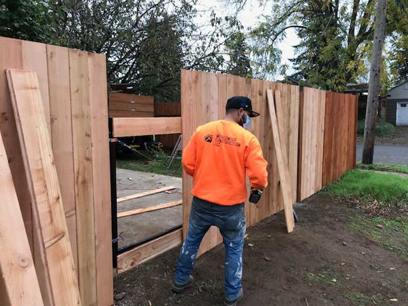 Tiane Kalamafoni Working on Fence